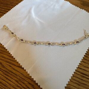 925 Sterling Silver 7 inch (end to end) with Cz stones.